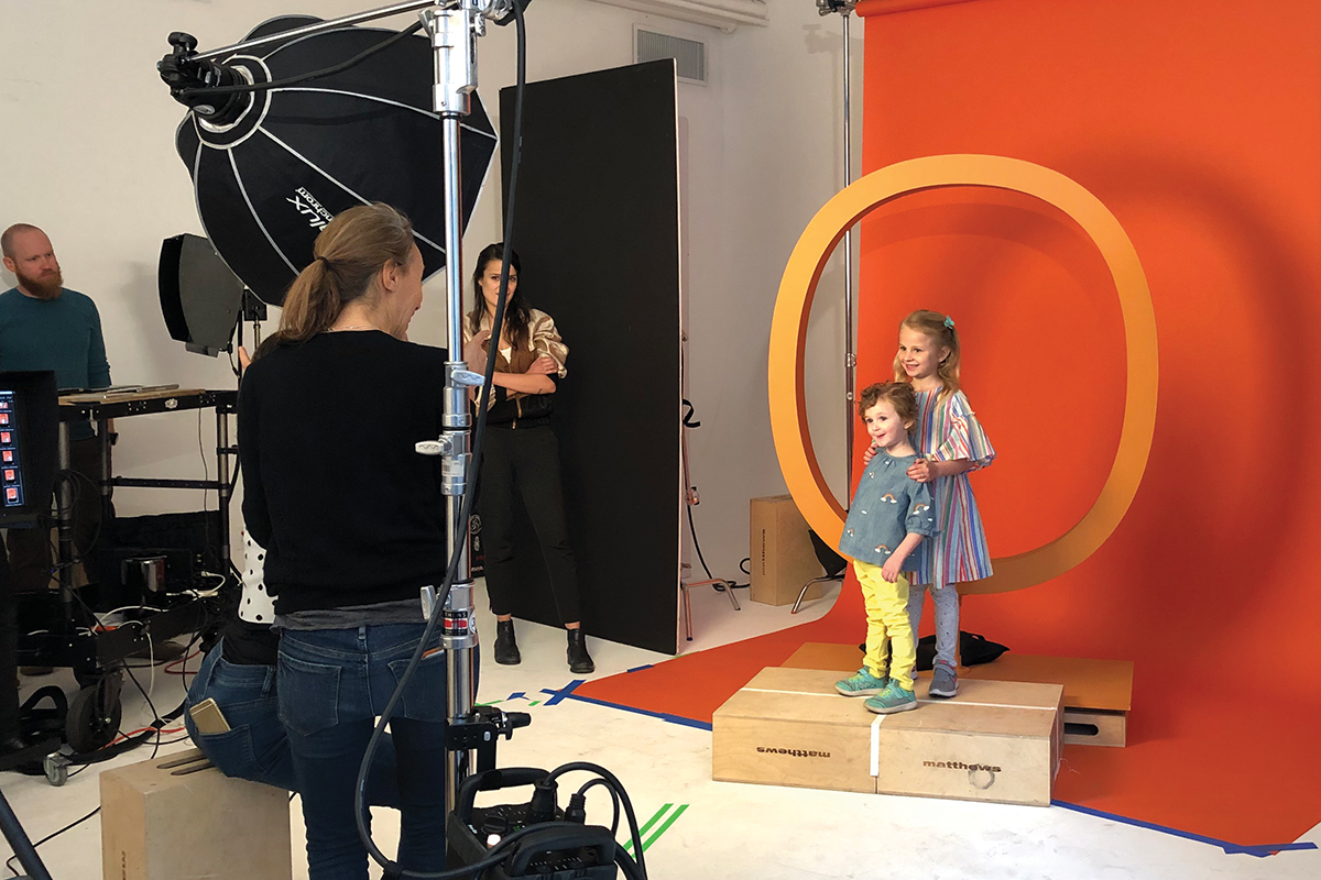 Two young girls posing for a photo