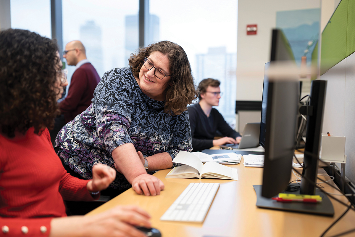 Computational biologist Dana Pe’er talks to a lab member