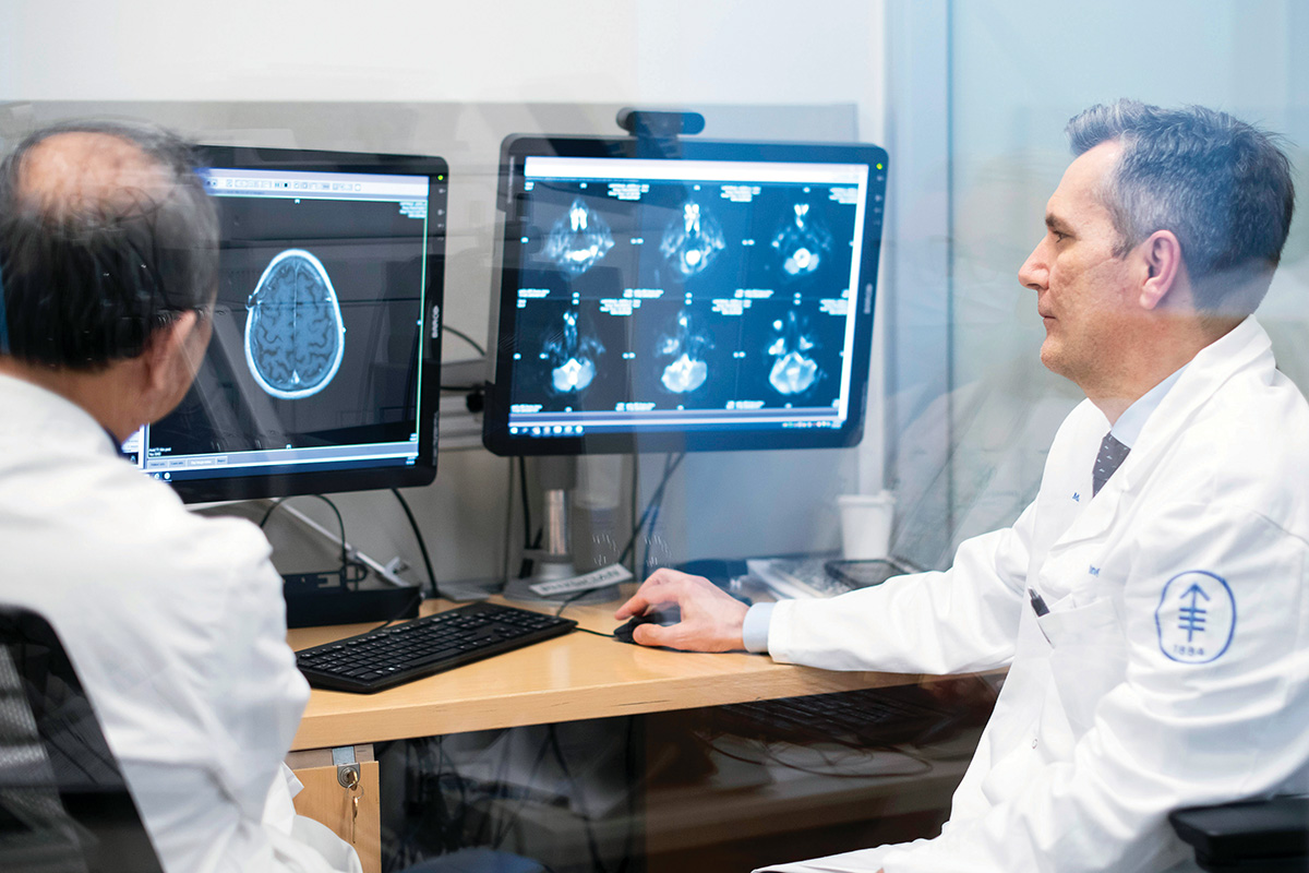 Memorial Sloan Kettering neuro-oncologist Ingo Mellinghoff looking at a computer