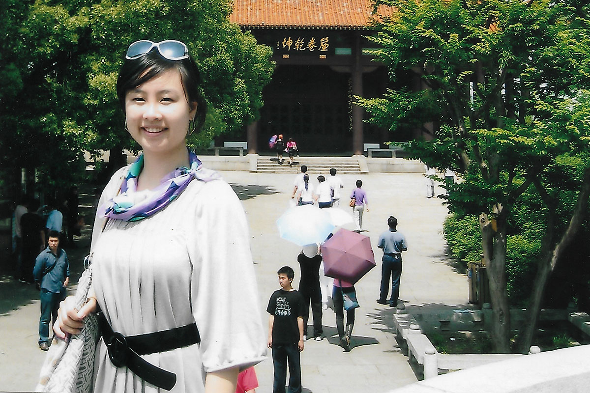 A college-aged Dr. Liu poses in front of the Yellow Crane Tower in Wuhan, Hubei Province