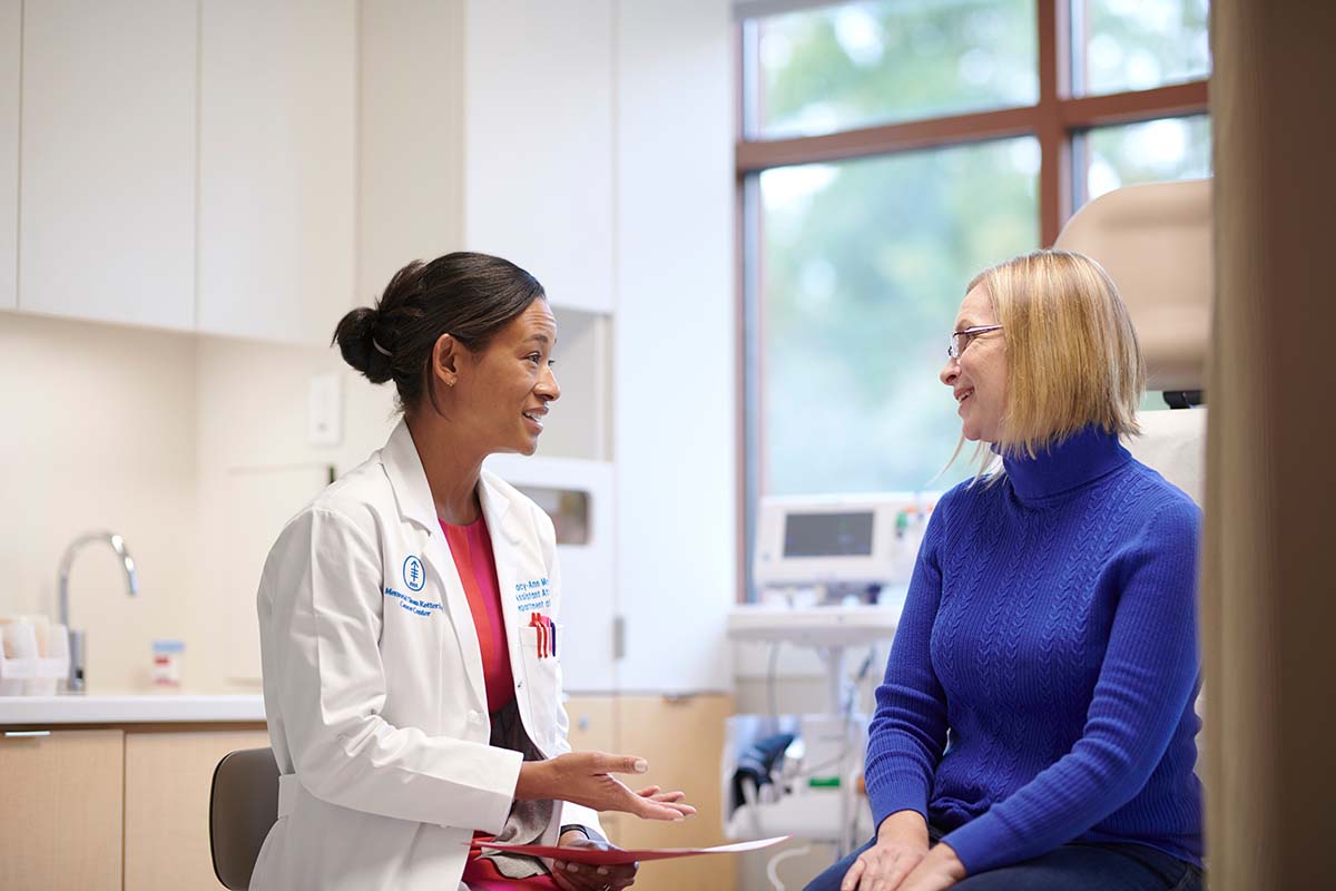 MSK breast surgeon Tracy-Ann Moo talks with a patient